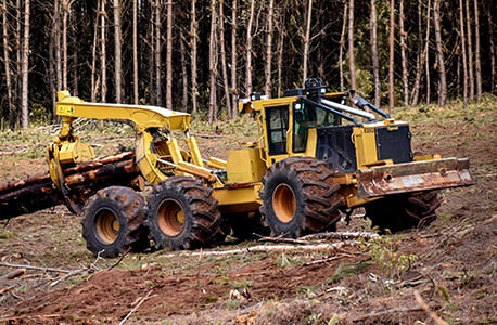 Log Skidder Carrying Logs